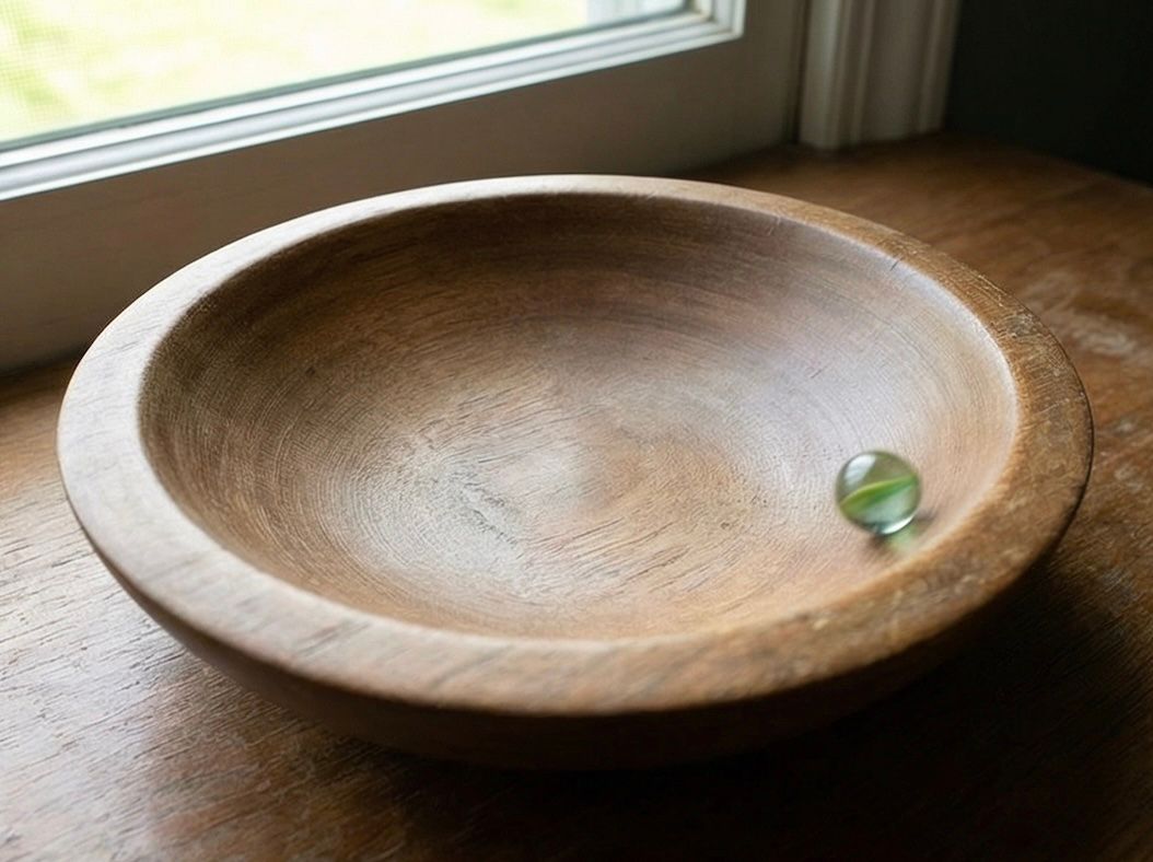 Spinning top maintaining equilibrium through continuous motion, illustrating the Lyapunov energy analogy: stability through dynamics rather than stasis.